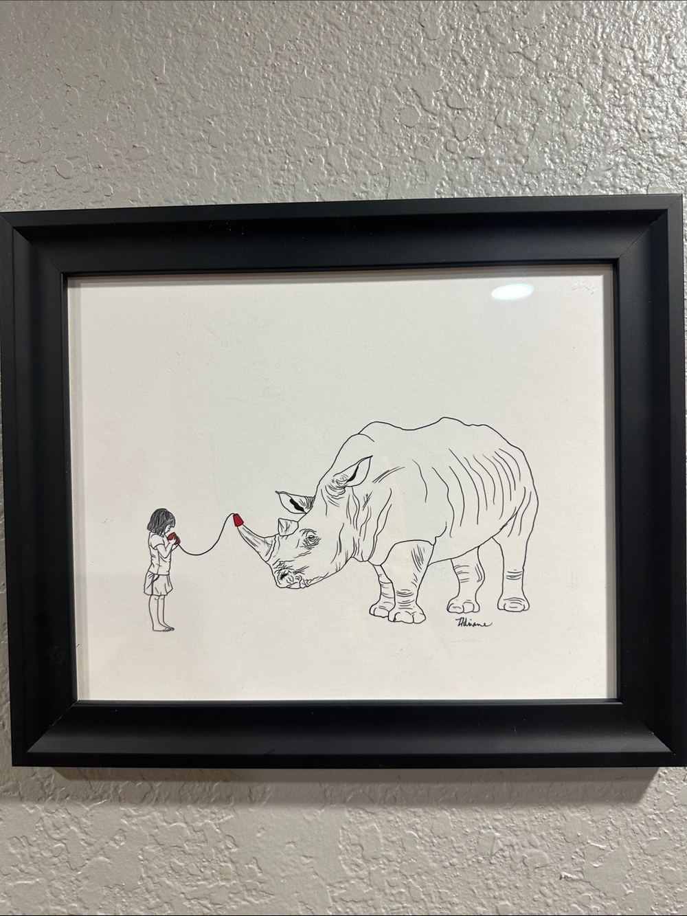 Black Line Rhino & Girl Illustration with Red Accent